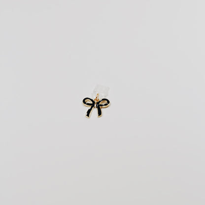 black bow • Charm